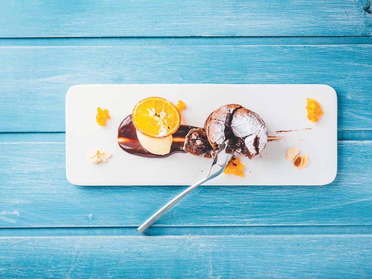 Food photography — plated dessert on blue timber